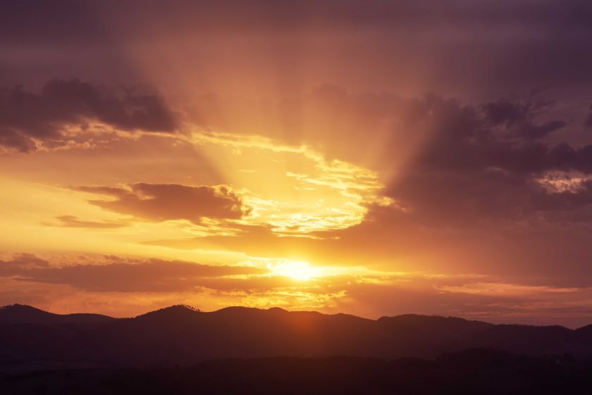 Sunset with dramatic clouds and sun rays